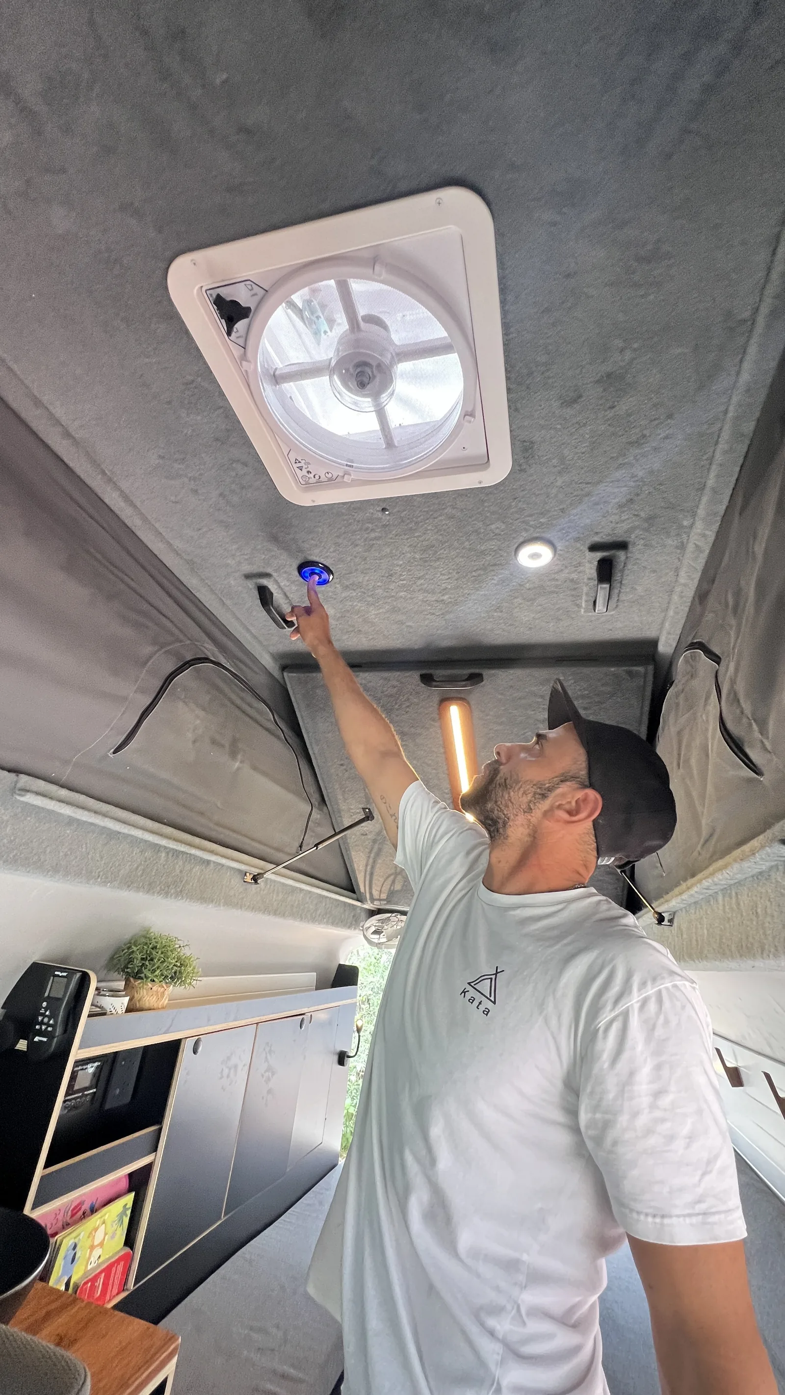 Kata installer fitting the Max Fan inside the pop-top