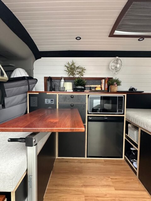 Toyota Hiace H300 SLWB – Full Custom Fit-Out

Built for comfort on the road and serious off-grid capability.

• Custom design with queen bed
• Hot shower setup
• Microwave for easy meals
• MaxxFan Deluxe powered ventilation
• Dometic 50L fridge
• Smart storage throughout: grocery pantry, garage storage, extra drawers + additional seat
• Lagun table for flexible dining/work space
• Victron power system
• 300Ah lithium battery + 3000W inverter
• External outdoor power point
• Fiamma black awning
• Interior bug-friendly mood lighting

Designed for rental use. Clean lines, functional layout, and fully equipped (and easy to use.)

#katacamperbox #ToyotaHiace #H300 #CamperConversion #VanLifeAustralia